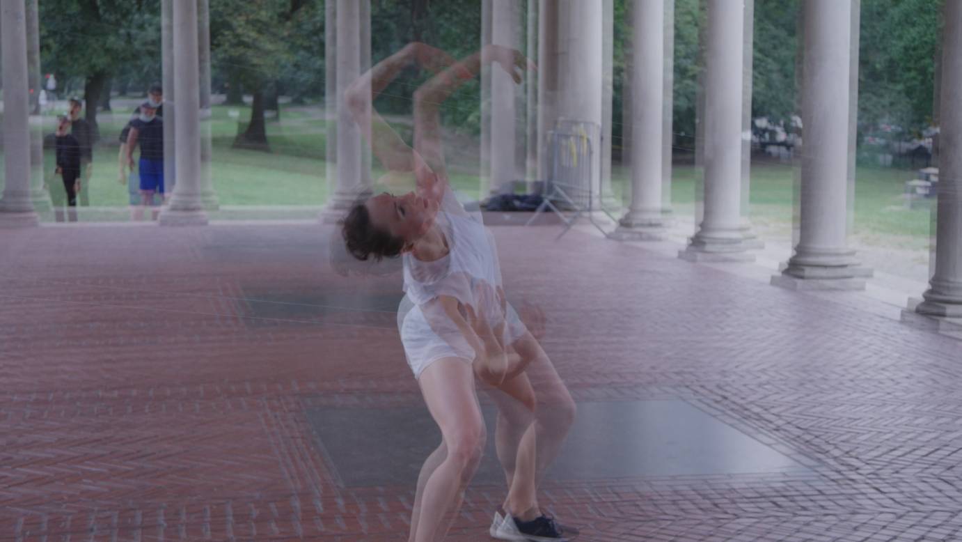 Belinda Mcguire dances in a pavilion in a Brooklyn park in a funky distorted picture